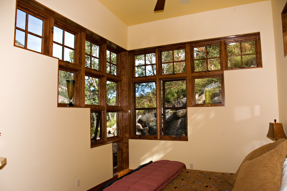 Design ideas for a small rustic master bedroom in Denver with beige walls.