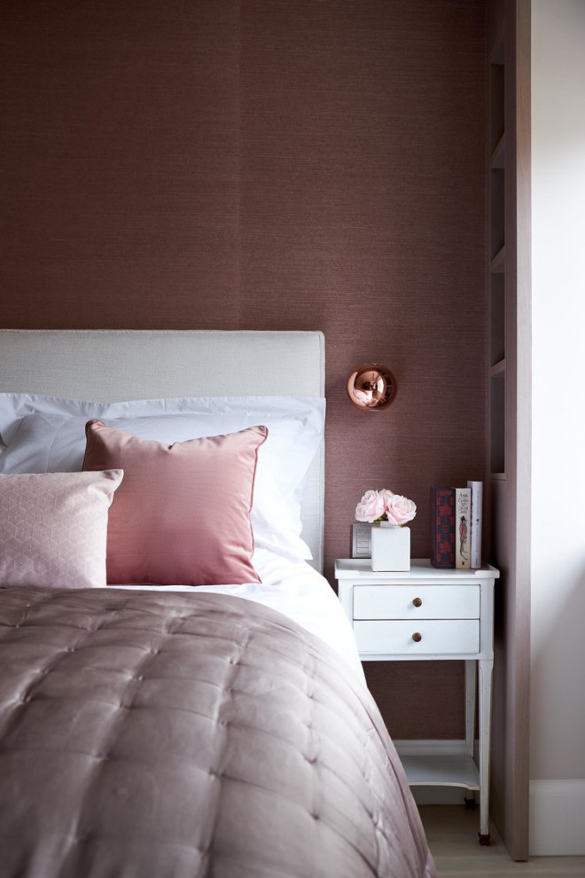 Bedroom - large contemporary guest light wood floor and wallpaper bedroom idea in London with pink walls