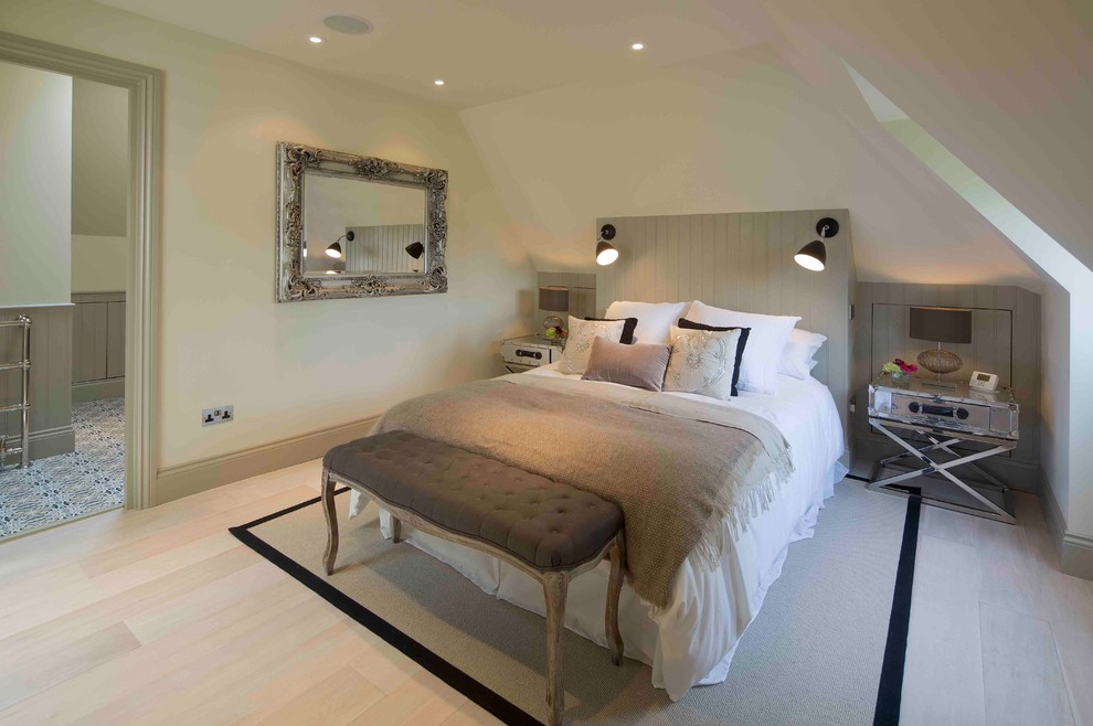 Medium sized classic master bedroom in London with beige walls, light hardwood flooring and white floors.