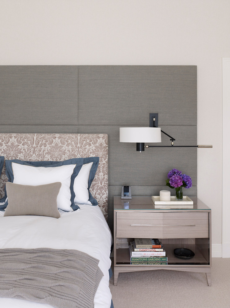 Beach style carpeted bedroom photo in New York with beige walls