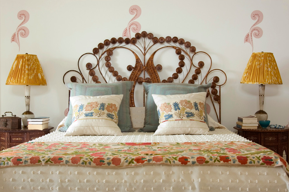 Example of a mid-sized eclectic master bedroom design in New York with beige walls