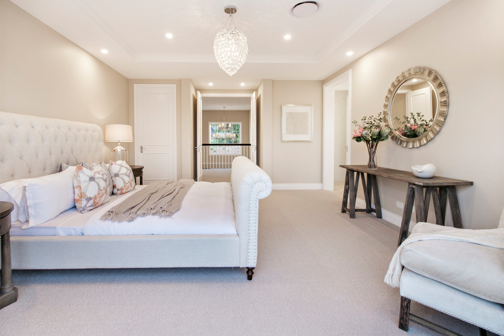 Example of a large classic master carpeted and beige floor bedroom design in Gold Coast - Tweed with beige walls and no fireplace