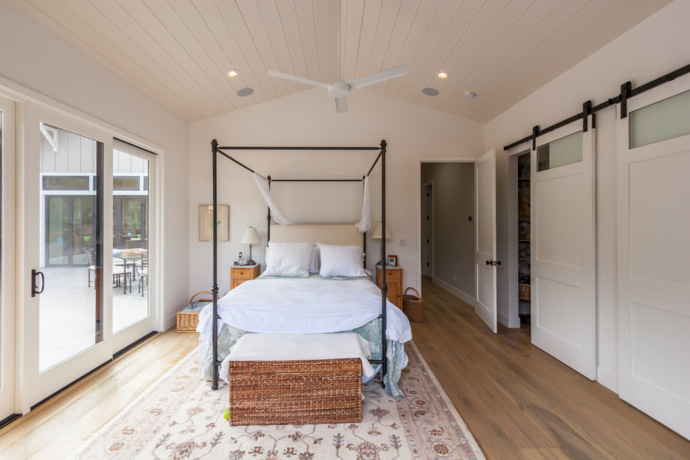 Example of a farmhouse bedroom design in Other