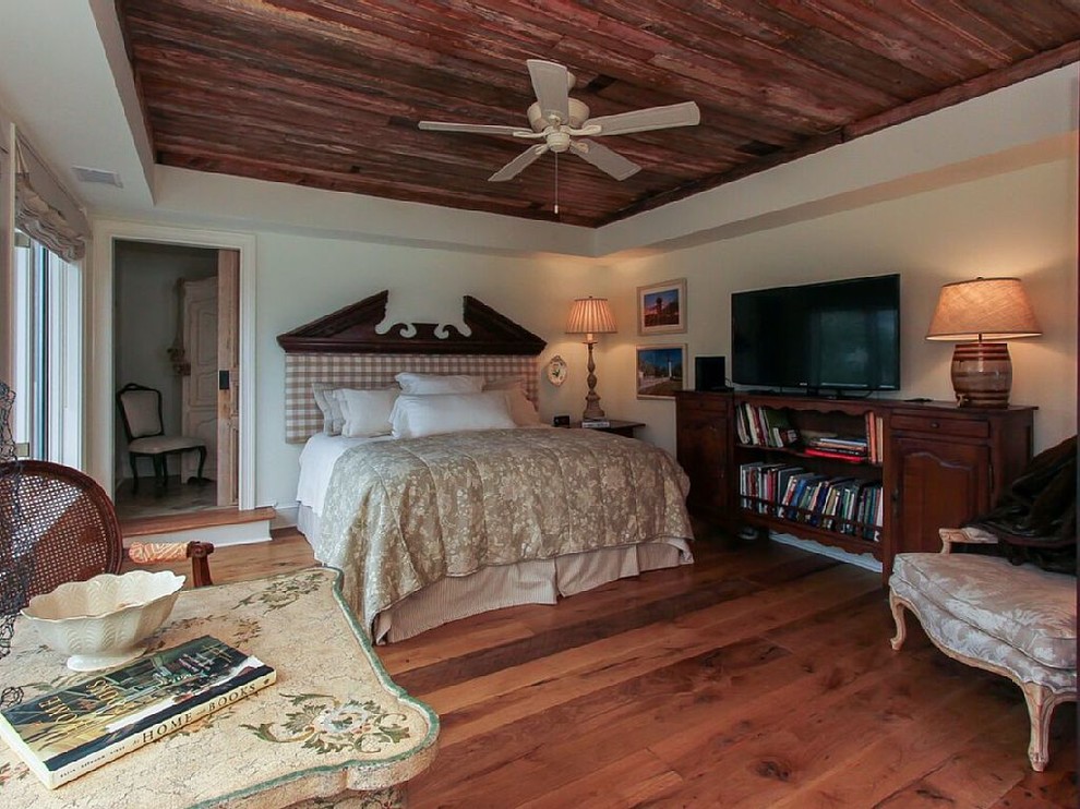 Large elegant master dark wood floor bedroom photo in Atlanta with white walls