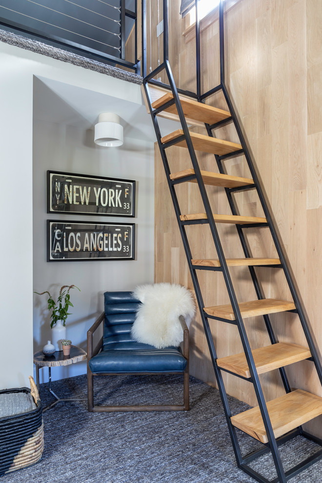 Urban loft-style carpeted, wallpaper and gray floor bedroom photo in New York with gray walls