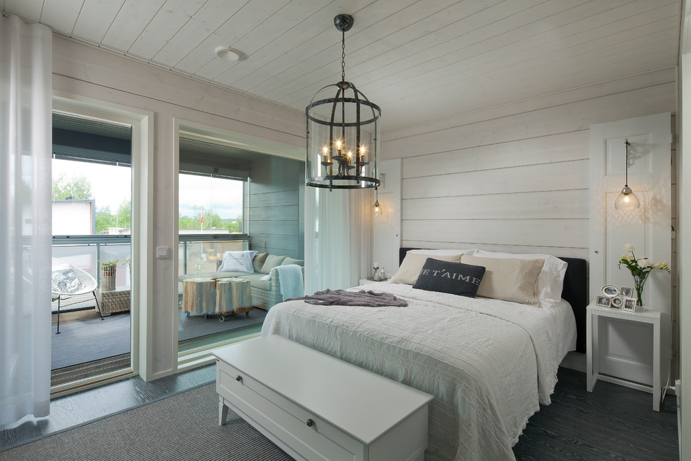 Bedroom - scandinavian dark wood floor bedroom idea in Devon with white walls