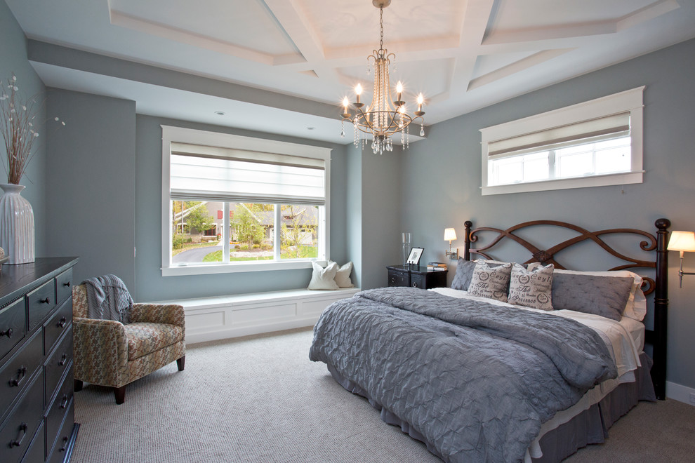 Design ideas for a large traditional master bedroom in Grand Rapids with grey walls and carpet.