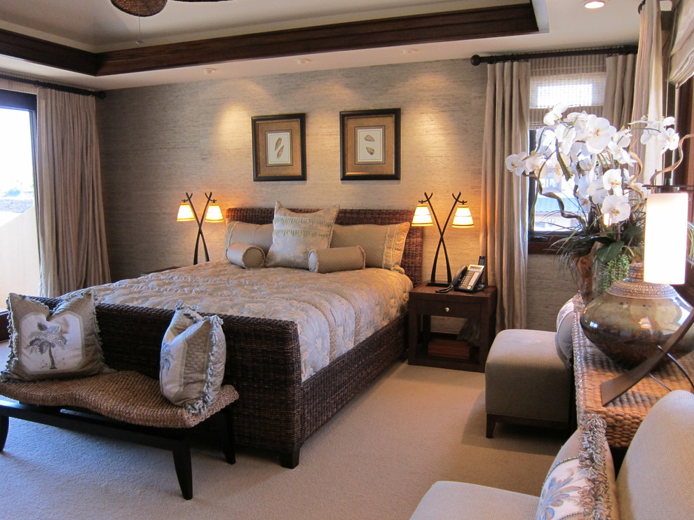 This is an example of a medium sized world-inspired guest bedroom in Hawaii with beige walls, carpet and no fireplace.