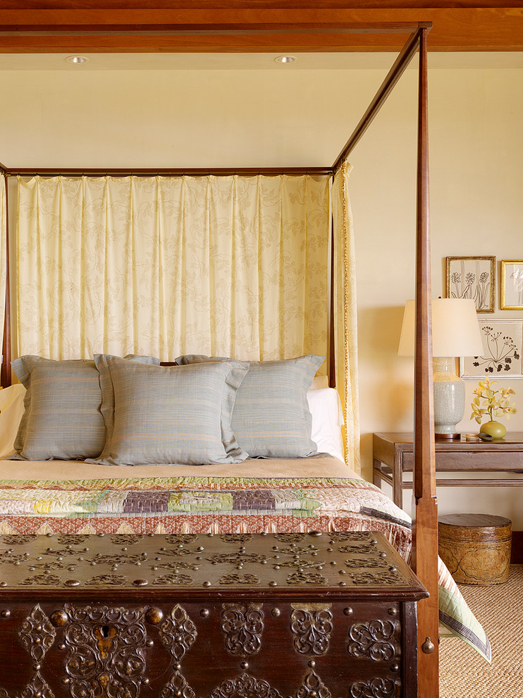 Large world-inspired master bedroom in Hawaii with beige walls and carpet.