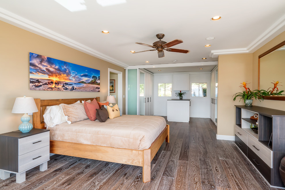 This is an example of a large world-inspired master bedroom in Hawaii with beige walls.