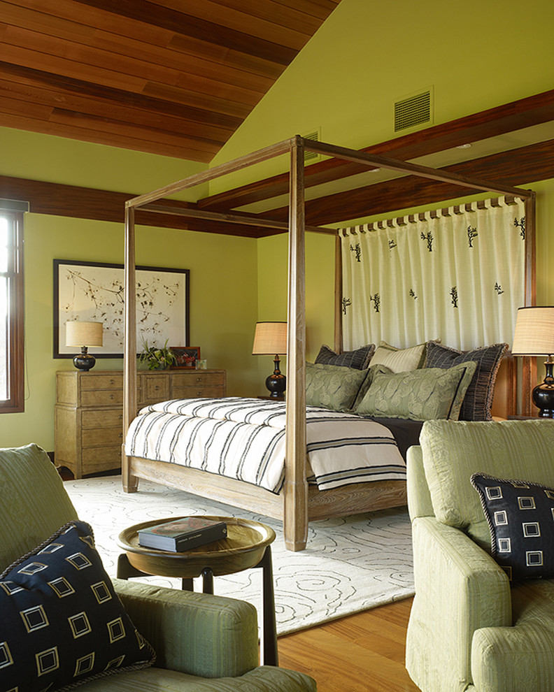 World-inspired bedroom in Hawaii with green walls.