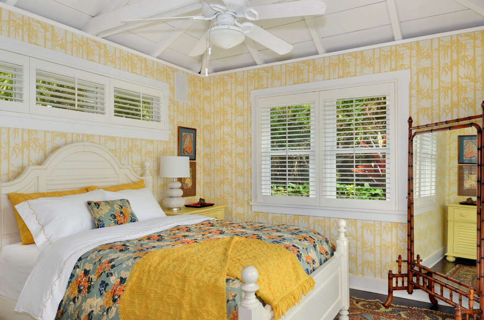Bedroom - tropical bedroom idea in Hawaii with yellow walls
