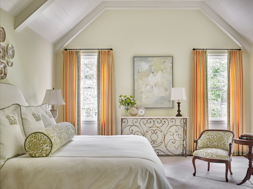 Inspiration for a traditional bedroom in Atlanta with beige walls and carpet.
