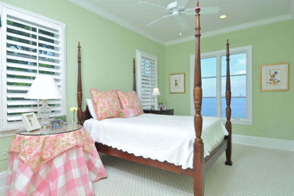 Inspiration for a mid-sized coastal loft-style carpeted bedroom remodel in Tampa with green walls and no fireplace