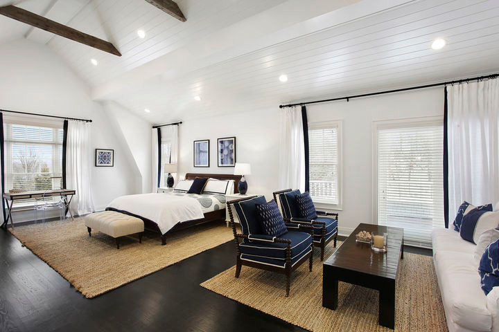 Photo of a medium sized classic guest bedroom in New York with dark hardwood flooring, no fireplace, brown floors and white walls.