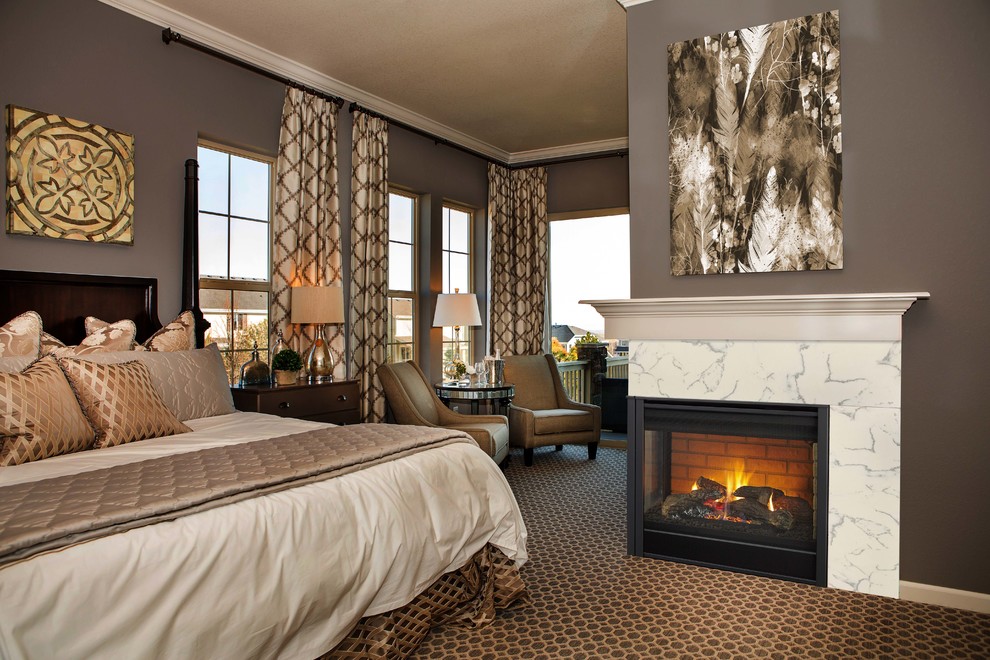 На фото: большая хозяйская спальня в стиле неоклассика (современная классика) с коричневыми стенами, ковровым покрытием, стандартным камином, фасадом камина из плитки и коричневым полом с