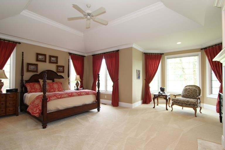 Inspiration for a mid-sized transitional master carpeted bedroom remodel in Cincinnati with beige walls