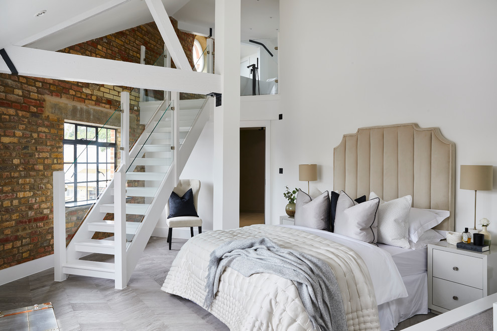 Classic bedroom in London with white walls and grey floors.