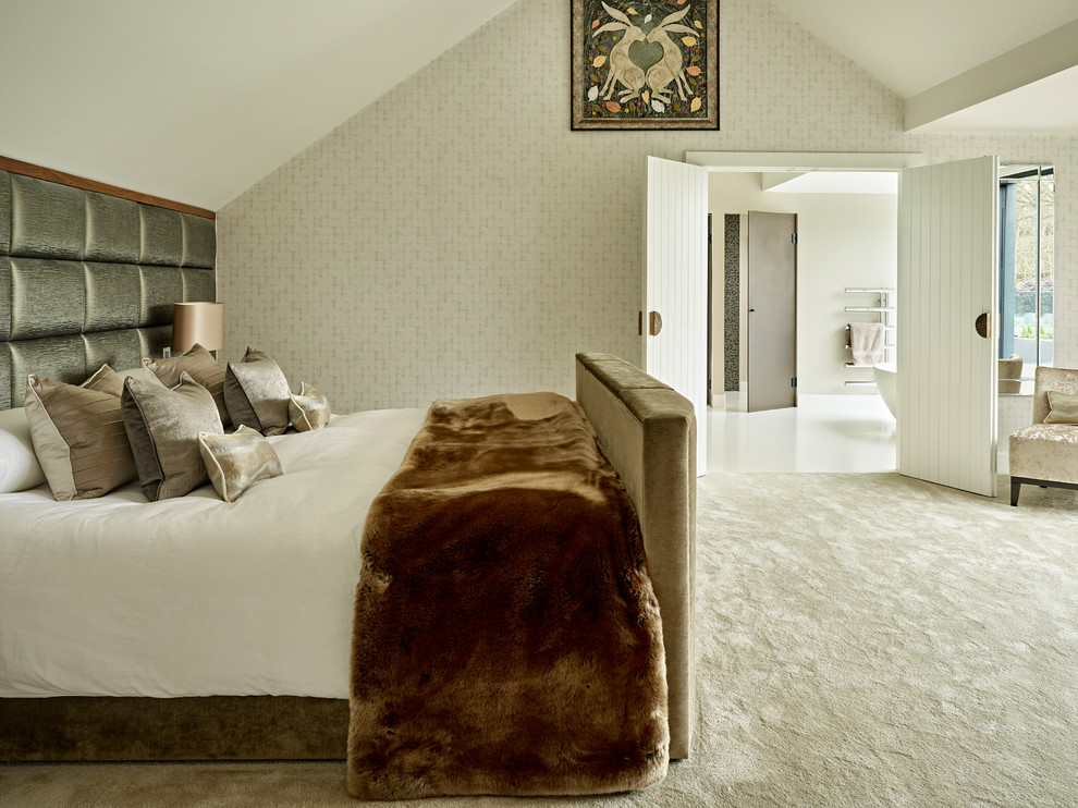 Photo of a contemporary master bedroom in London with beige walls, carpet and beige floors.