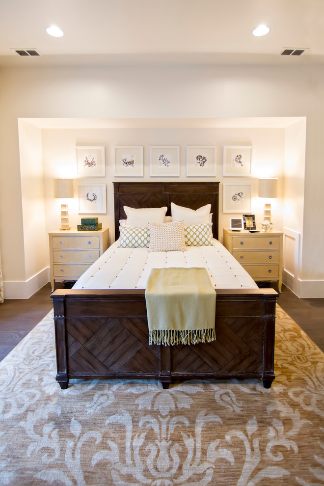 Photo of a large world-inspired master bedroom in Jacksonville with white walls, dark hardwood flooring, no fireplace, brown floors and feature lighting.