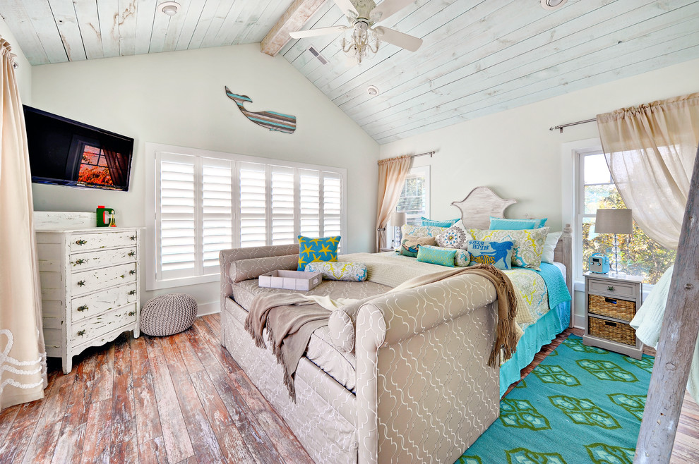 Photo of a beach style bedroom in Philadelphia with white walls, medium hardwood flooring and no fireplace.