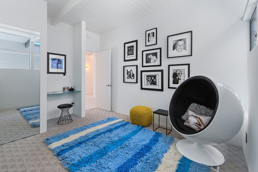 Inspiration for a mid-century modern carpeted bedroom remodel in Los Angeles with white walls