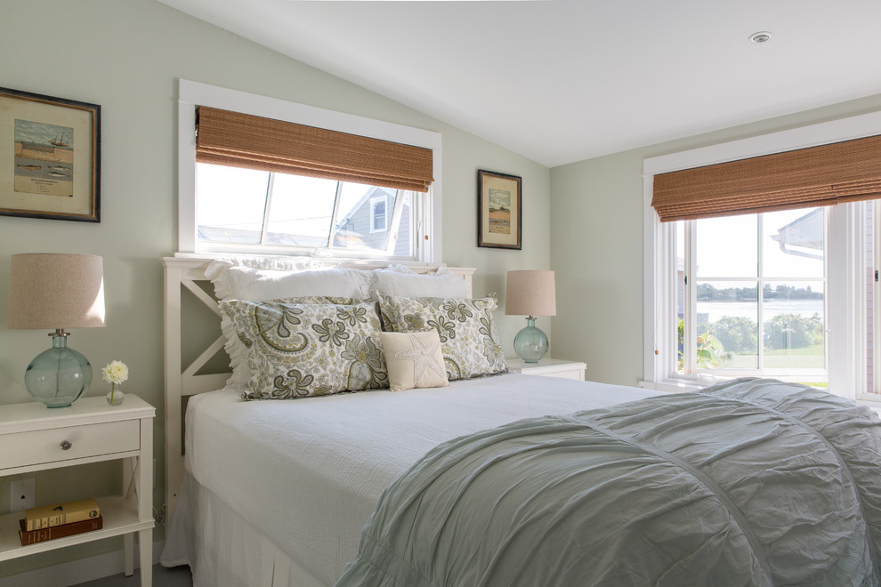 Inspiration for a small beach style guest bedroom in Portland Maine with green walls and light hardwood flooring.