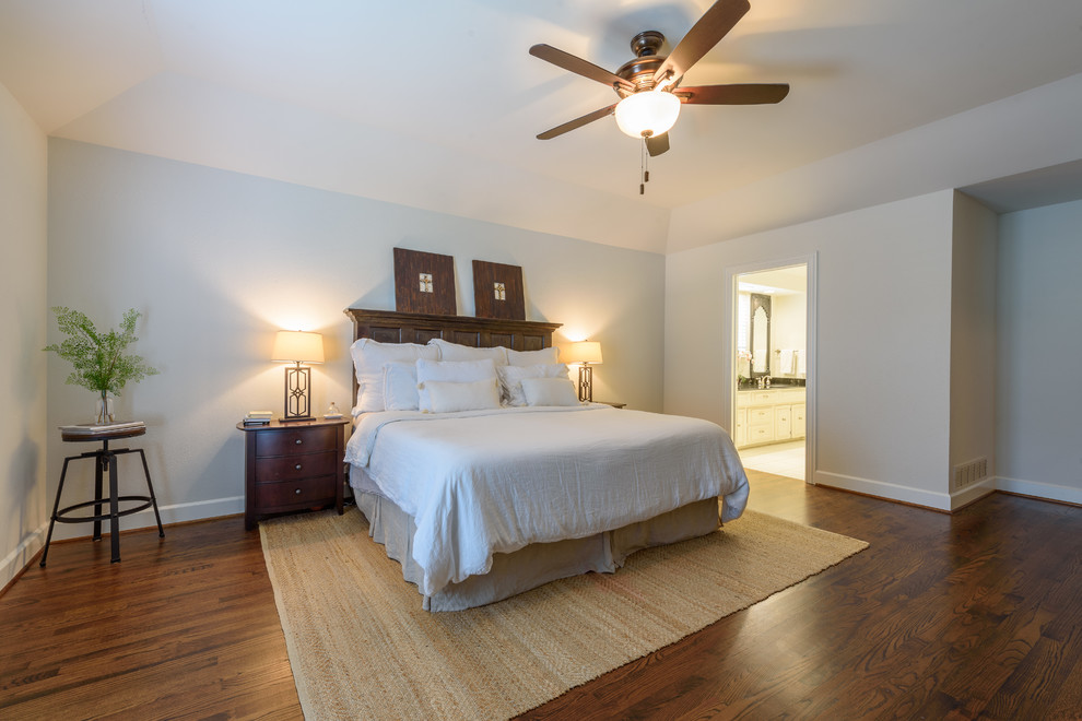 Large elegant master dark wood floor and brown floor bedroom photo in Dallas with beige walls and no fireplace