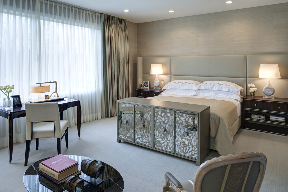 This is an example of a contemporary grey and silver bedroom in Chicago with beige walls and carpet.
