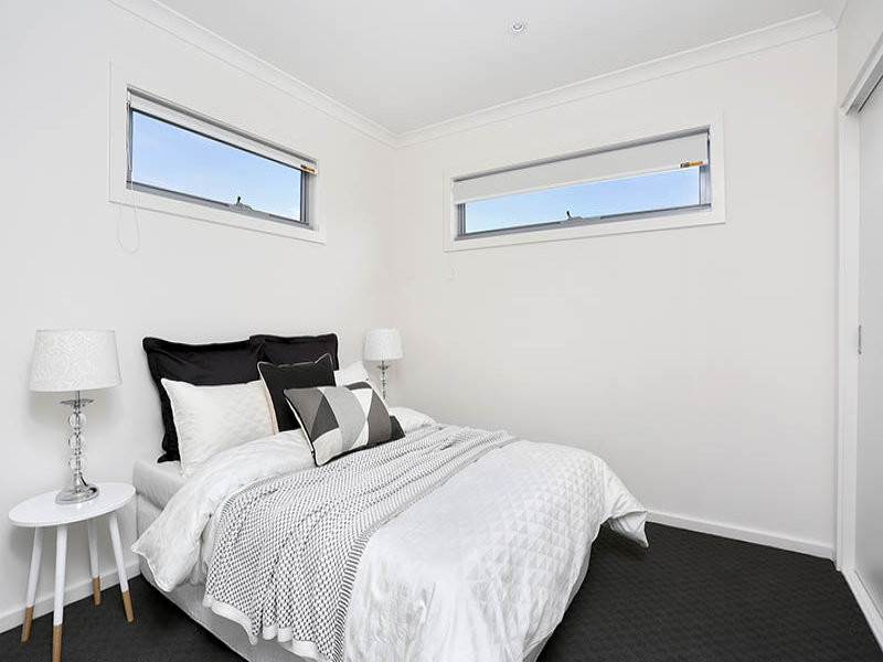 Example of a mid-sized trendy master carpeted bedroom design in Melbourne with white walls