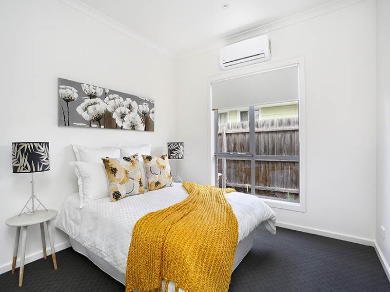 Bedroom - mid-sized contemporary guest carpeted bedroom idea in Melbourne with white walls