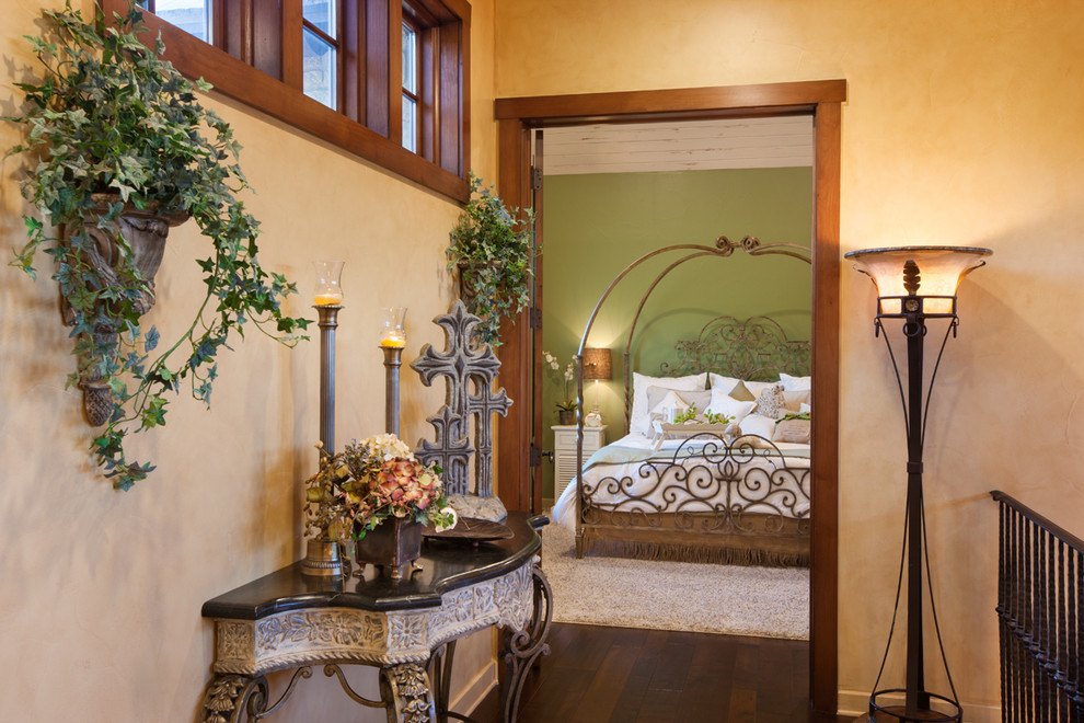 Example of a large classic master dark wood floor bedroom design in Austin with beige walls