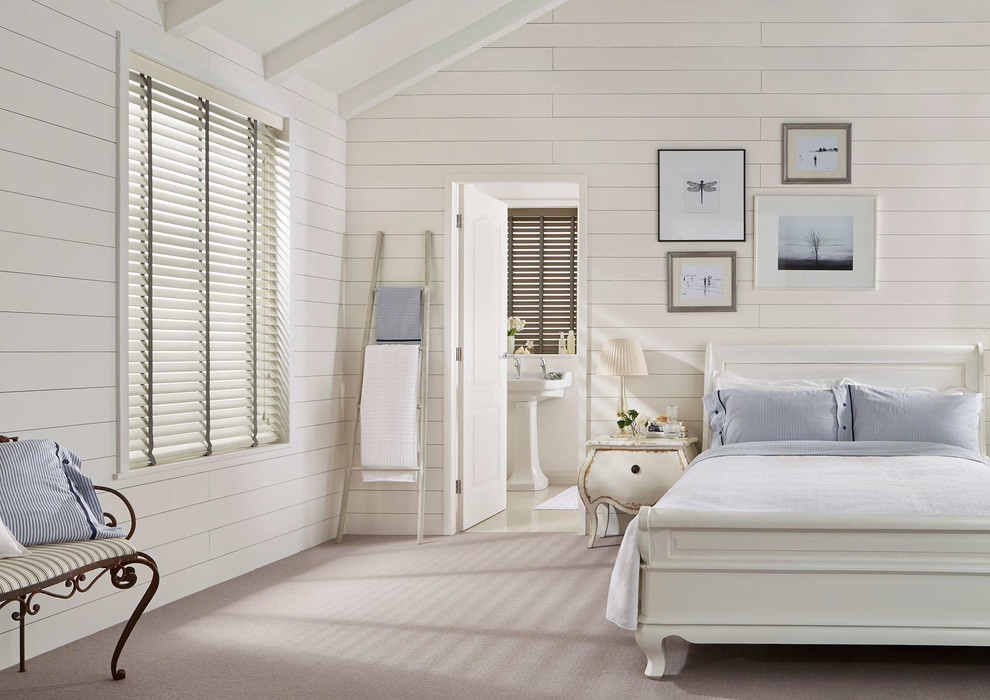 This is an example of a large contemporary master bedroom in Other with white walls and carpet.