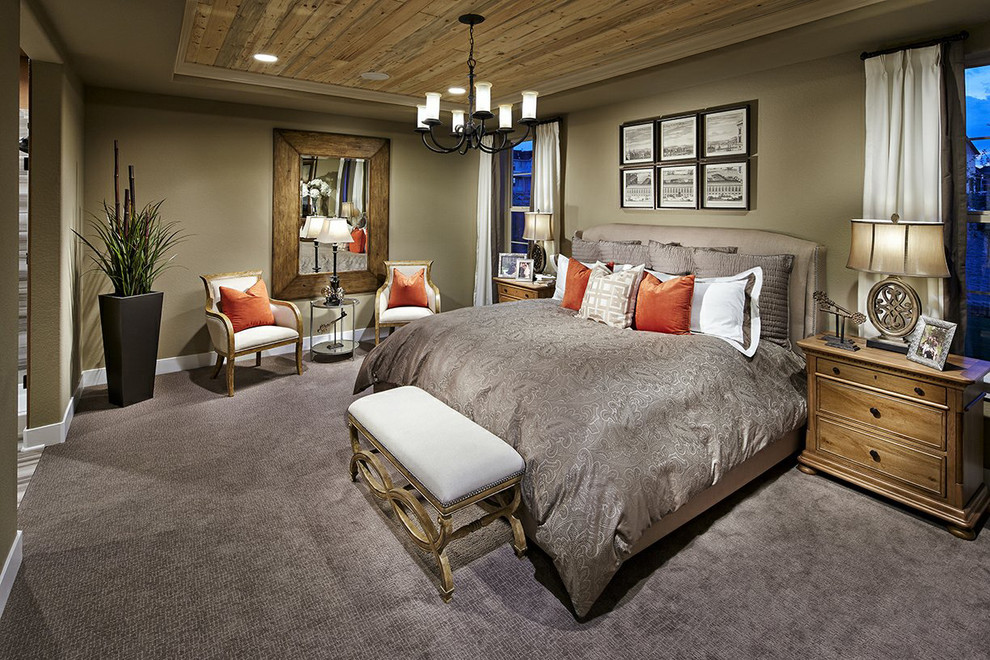 This is an example of a large traditional master bedroom in Denver with beige walls, carpet and no fireplace.