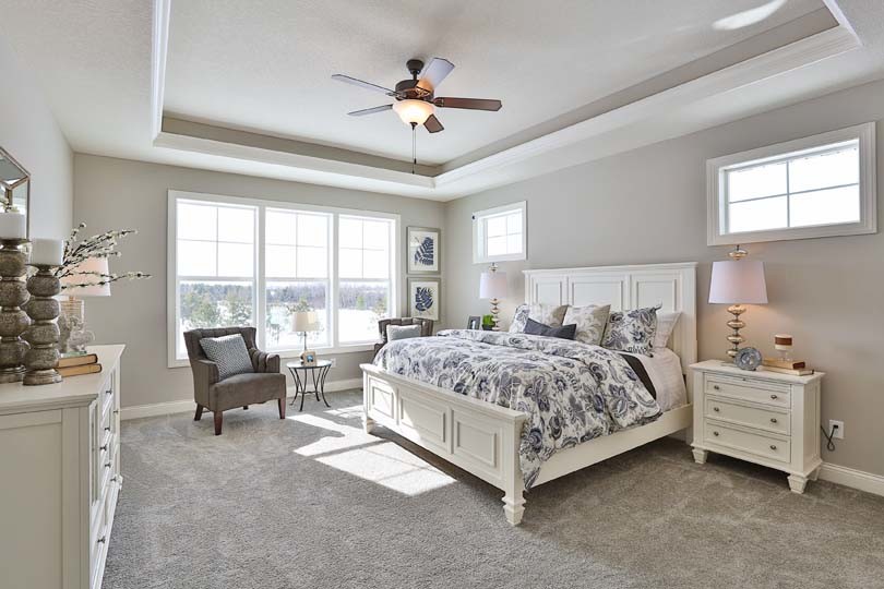 Design ideas for a medium sized traditional master and grey and silver bedroom in Minneapolis with grey walls and carpet.
