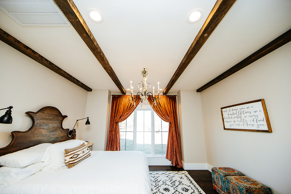 Photo of a farmhouse master bedroom in Austin with bamboo flooring.