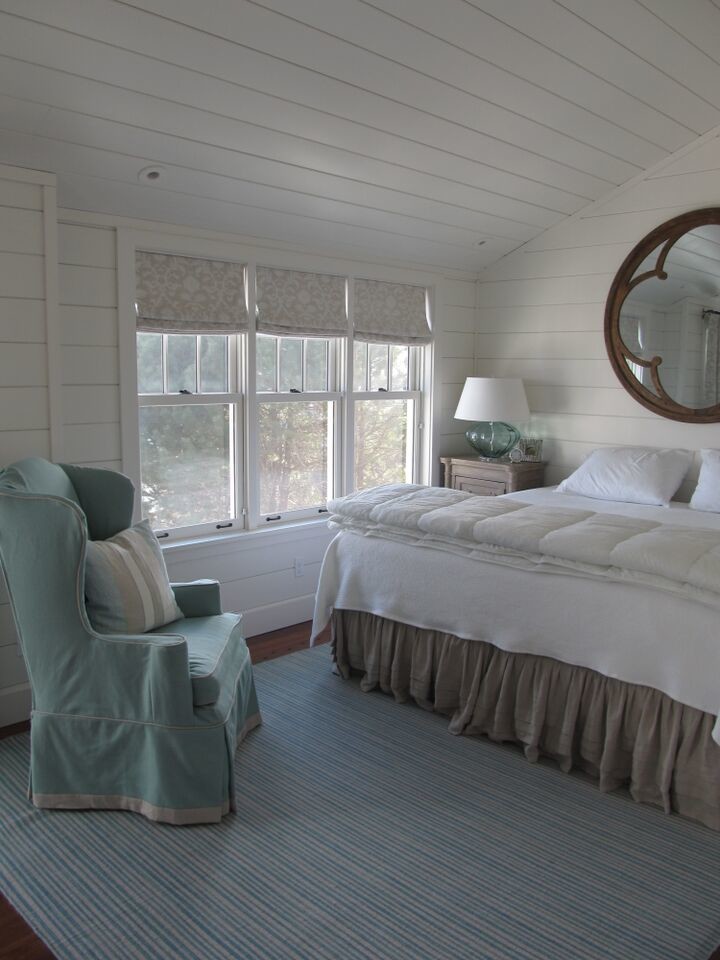 Bedroom - small transitional guest medium tone wood floor bedroom idea in Portland Maine with white walls and no fireplace