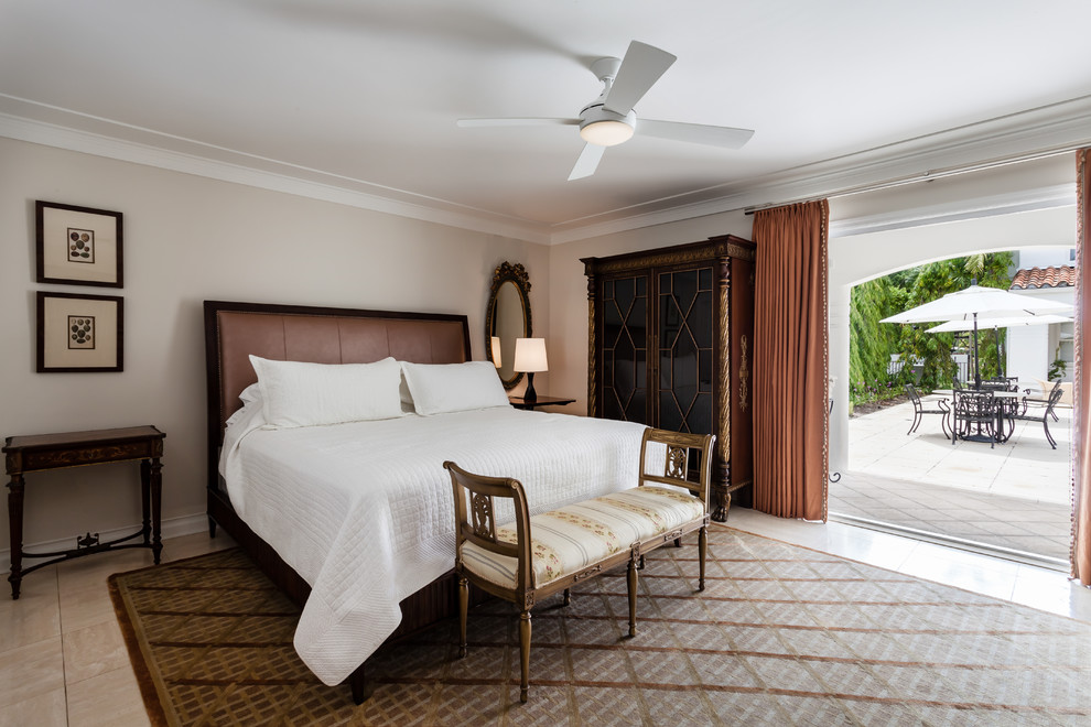 Mediterranean master bedroom in Miami with beige walls.