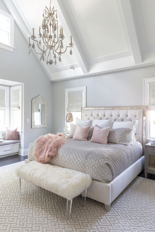 Photo of a small coastal master bedroom in New York with grey walls, medium hardwood flooring and brown floors.