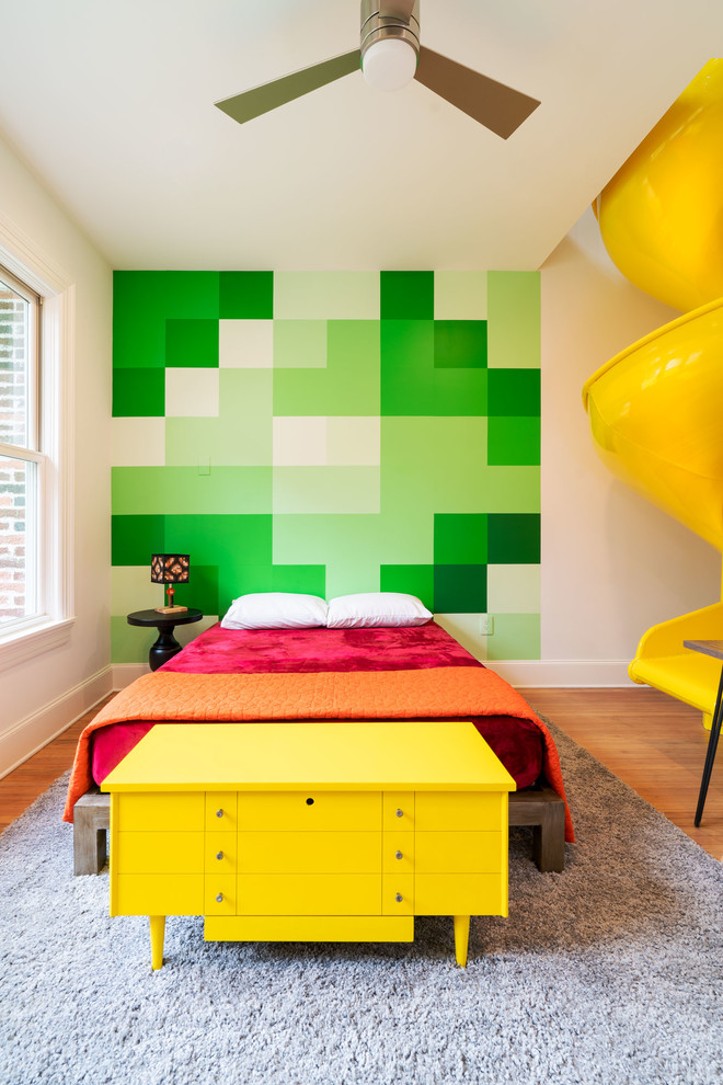 Medium sized contemporary guest bedroom in Austin with medium hardwood flooring.