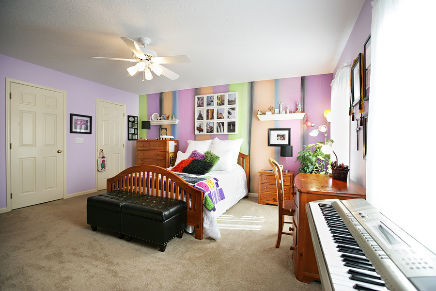 Medium sized traditional guest bedroom in Other with purple walls, carpet and no fireplace.