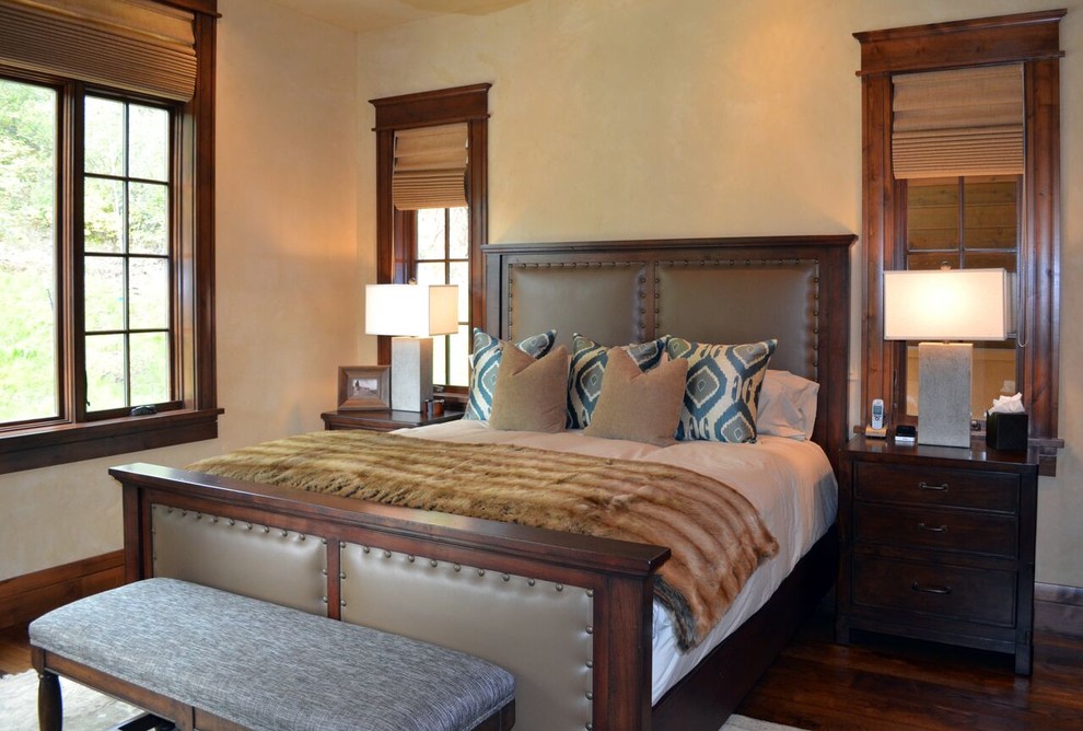 Bedroom - transitional guest dark wood floor bedroom idea in Denver with beige walls