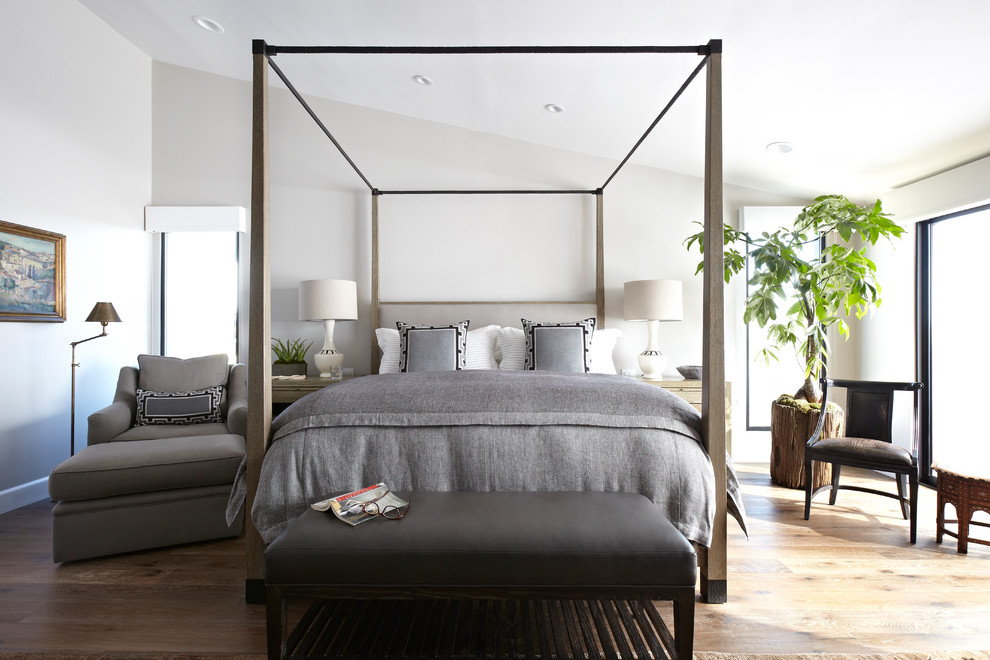 Design ideas for a classic bedroom in Los Angeles with white walls and dark hardwood flooring.