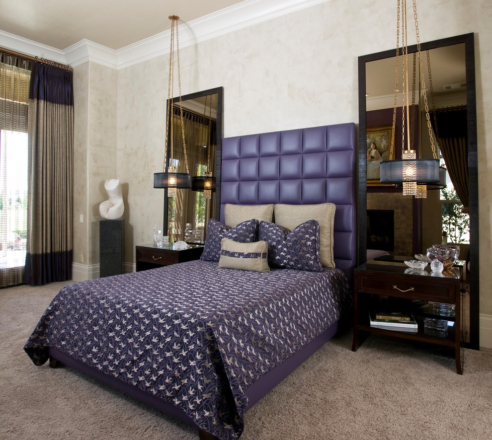 Photo of a large contemporary master bedroom in Sacramento with beige walls, carpet, a standard fireplace, a tiled fireplace surround and beige floors.