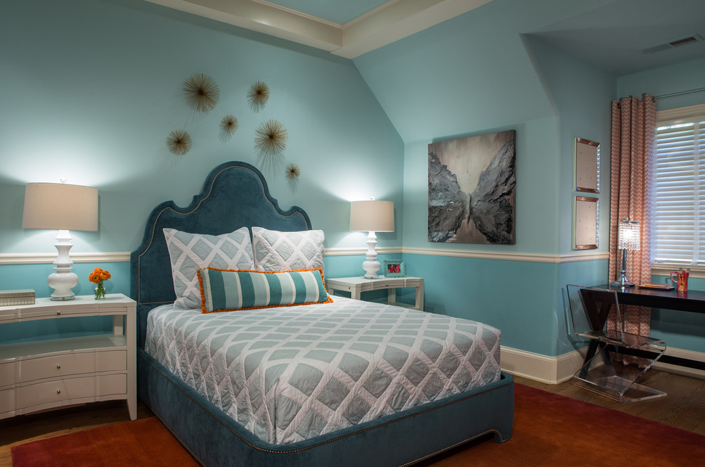 Large transitional medium tone wood floor and brown floor bedroom photo in Atlanta with blue walls