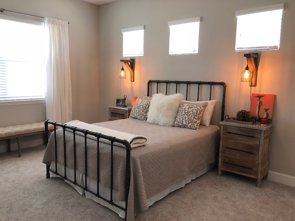 Medium sized traditional master bedroom in Orlando with grey walls, carpet, no fireplace and beige floors.