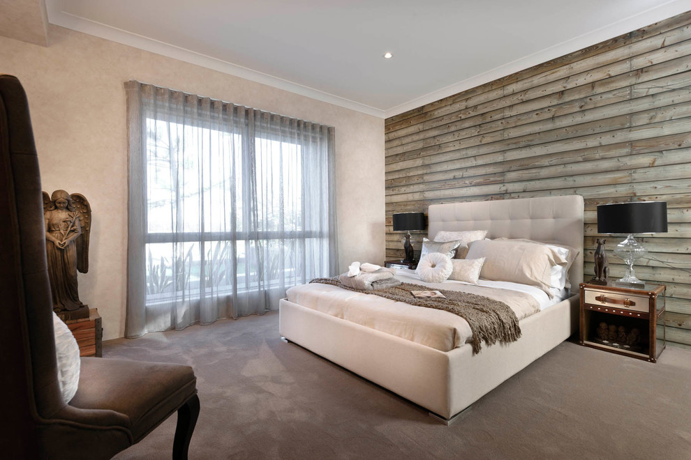 Immagine di una camera da letto design con pareti beige, moquette e nessun camino