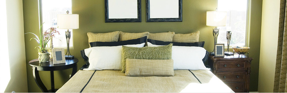 Esempio di una camera degli ospiti minimalista di medie dimensioni con pareti verdi