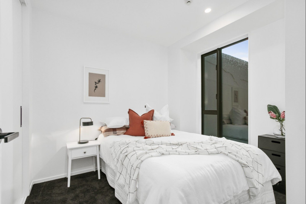 Photo of a contemporary bedroom in Auckland.