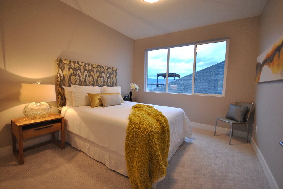 Design ideas for a contemporary guest and grey and yellow bedroom in Vancouver with grey walls and carpet.